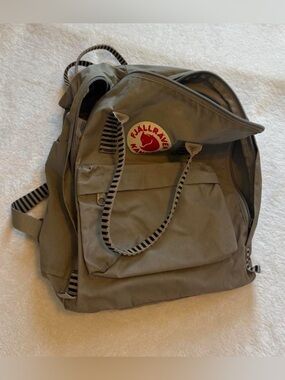 Fjallraven Kånken Backpack in Olive Green with Red Logo